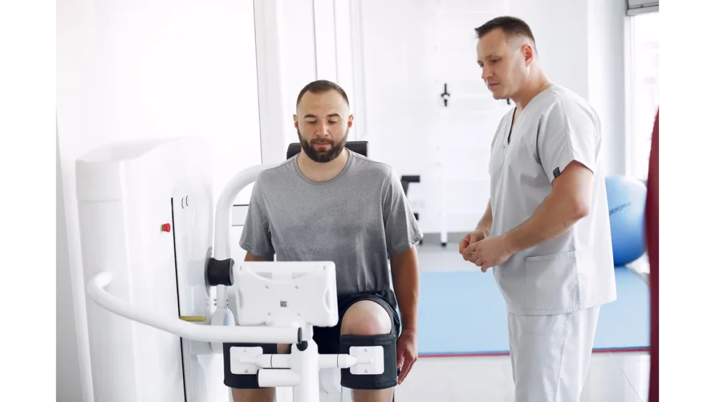Doctor with a patient in physiotherapy clinic